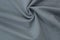 Gray background of fabric from a piece of crumpled clothes