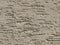 Gray background facade plaster . Monolithic plaster decorative backdrop. Single layer scraped cement plaster wallpaper. Brow exter