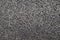Gray black granular asphalt road with small stones. rough surface texture