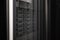 gray black server cabinet door made of perforated metal with network storage hard drives