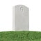 Gray blank gravestone on green grass isolated