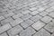 Gray brick urban pavement, background texture