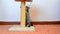 Gray british kitten playing with toy and scratching post