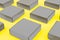 Gray bulk boxes on a yellow background. Color of the year 2021