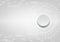 Gray button on white user interface background with small dots a