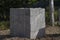 Gray cement blocks on wooden pallet at  side of road