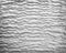 Gray cement wall in wave patterns texture abstract background