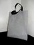 Gray color bag and black handle, Non woven Bag, Polypropylene Non Woven Bag on table