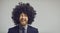 Gray copy space banner with portrait of funny laughing man in suit and crazy curly wig