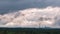 Gray Cumulus Clouds Moves over the Horizon and an Industrial Plant, Timelapse