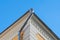 Gray drainpipe on the corner of the building