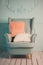 Gray easy armchair with pink scarf, pillow and book next to bed