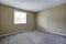 Gray Empty room interior with one window and carpet floor.
