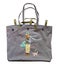 gray fabric tote bag with girl and dog appliqued