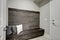 Gray Foyer features Half wood plank accent wall