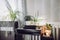 Gray gender neutral home office with lot of calming green live potted flower plants growing. Green healthy calm lifestyle concept.