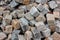 Gray gravel close up photo for background. Sharp stones in pile for construction. Road or building construction supply