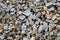 Gray gravel photo for background. Sharp stones in pile for construction. Road or building construction supply. Gray