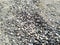 Gray gravel stones for the construction industry. Mound of granite gravel, stones, crushed stone close-up