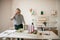 Gray-haired adult architect man working in office