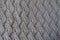Gray handmade knit fabric with relief pattern from above