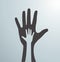 Gray helping hands. Idea of the sign for the association of care - hand in hand. Vector