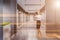 Gray hotel corridor, closed wooden doors, woman