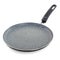 Gray marble pancake maker with black ceramic handle isolated on