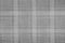 Gray material texture checkered light gray textured fabric background close-up