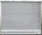 Gray metal garage gate with rolling shutters