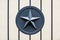 Gray metal star army military on metal fence gate