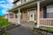 Gray mixed siding home with an elegant porch