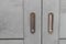 Gray modern Entrance door Exterior. Closed sliding Door with metal handles