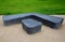 Gray monolithic concrete park bench made of concrete in the shape of round stones anthracite color park paths and interlocking pav