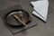 Gray napkin on table. Spoon and fork in empty cast iron skillet