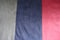 Gray, navy and red vertical strips of artificial suede sewn together