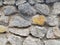 Gray and orange stone wall texture closup background
