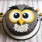 Gray Owl Cake With Quirky Expressions: A Unique And Playful Dessert