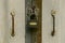 Gray padlock hangs on a closed iron door