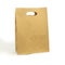 Gray paper bag on a white background. concept of rejection of plastic bags. close-up