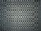 Gray perforated metal background texture