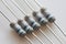 Gray power resistors with stripes on bright background