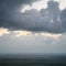 gray rain clouds over earth surface in evening