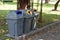 Gray recycle bin, trash bin in the park.