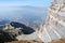 The gray rock on a background of a panorama of the mountains of Tien Shan