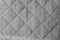 Gray rough quilted fabric pattern