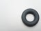 Gray rubber round expander for forearm on white background