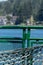 Gray safety netting and green metal railing on side of washington state ferry