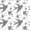 Gray silhouettes of swallows in flight on white