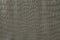 Gray-silver polyvinyl chloride film stamped like reptile skin. Texture.